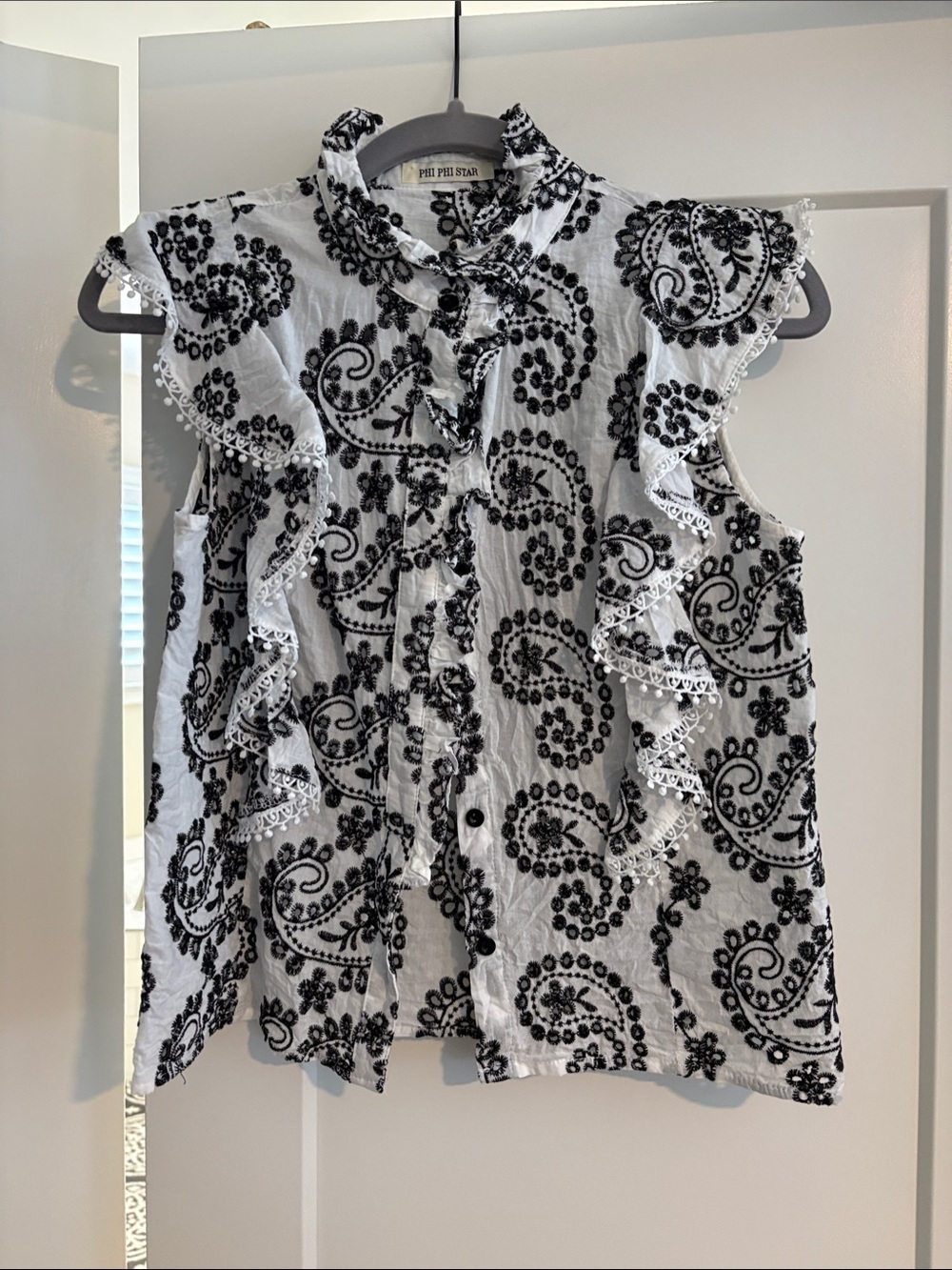 Phi Phi Star Ruffled Sleeveless Blouse - White with Black Embroidery